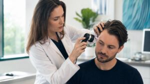 Medical scalp examination in bright clinic